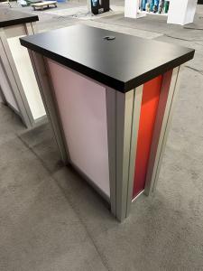 RENTAL: RE-1080 Inline Design with 110" Wide x 96" High Backwall, Boomerang Baseplates, Large Monitor Mount, (2) RE-1227 Small Rectangular Counters, SEG Fabric Graphic, and Direct Print Sintra Graphics -- View 3